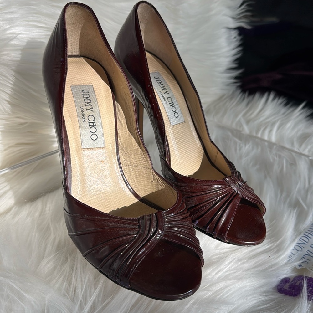 Jimmy Choo peep toe pumps in a wine color, size 36.5